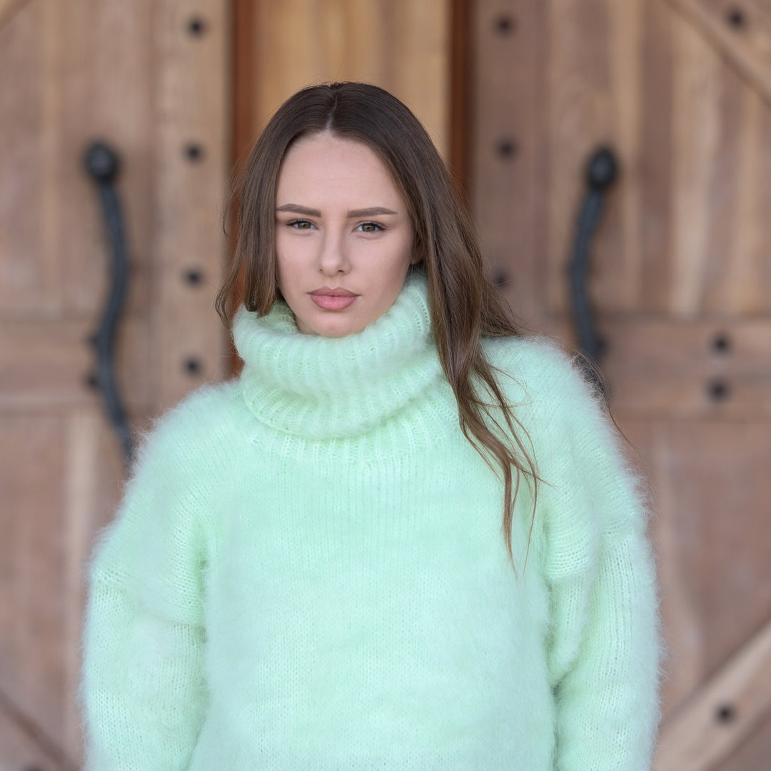 Pale mint green Kid Mohair oversized turtleneck sweater T2410 close-up portrait