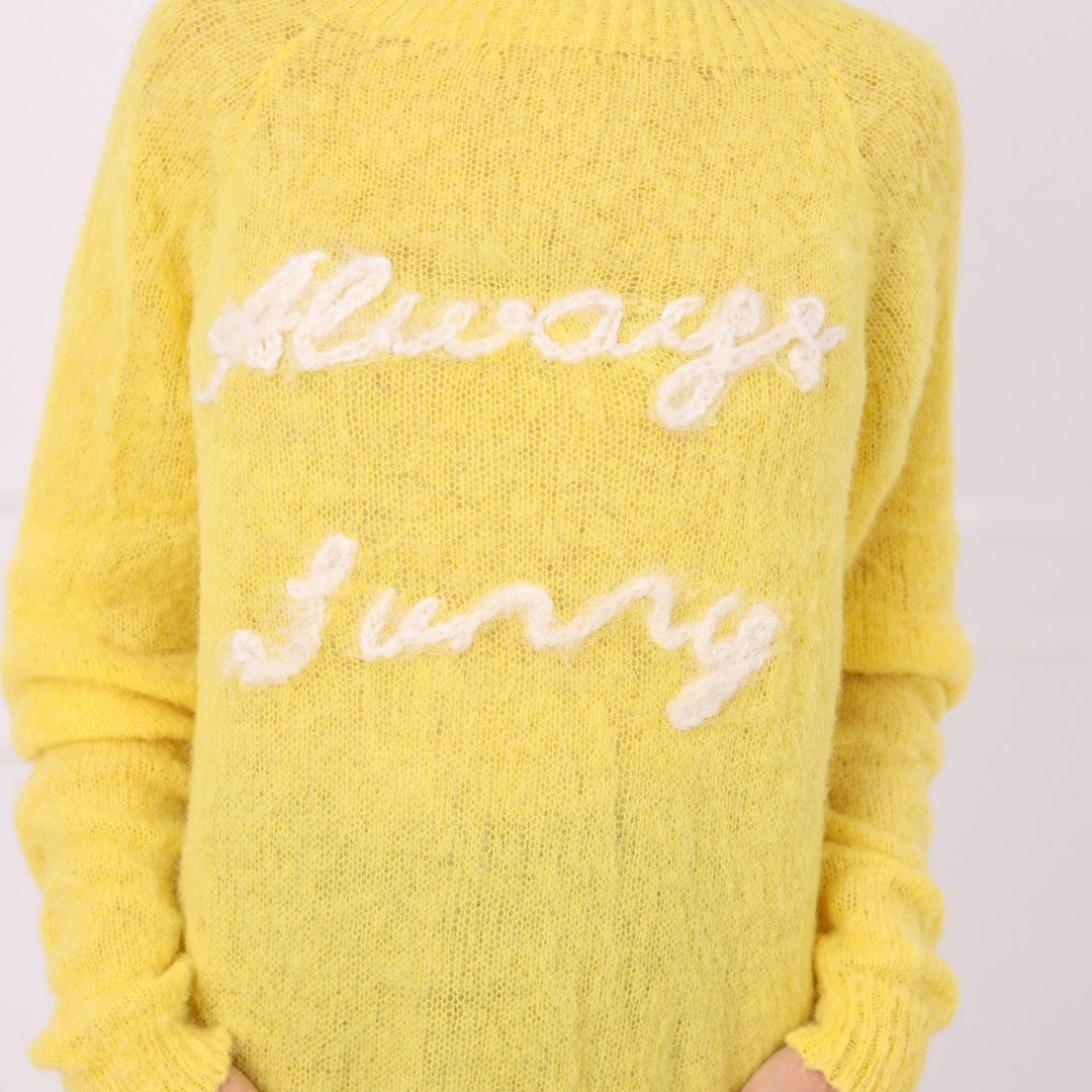 Custom embroidered alpaca sweater in soft yellow with white personalized text