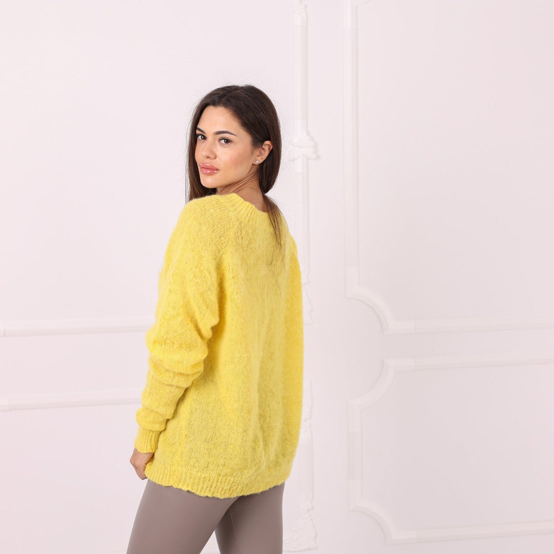 Side view of yellow baby alpaca hand knit sweater with custom text