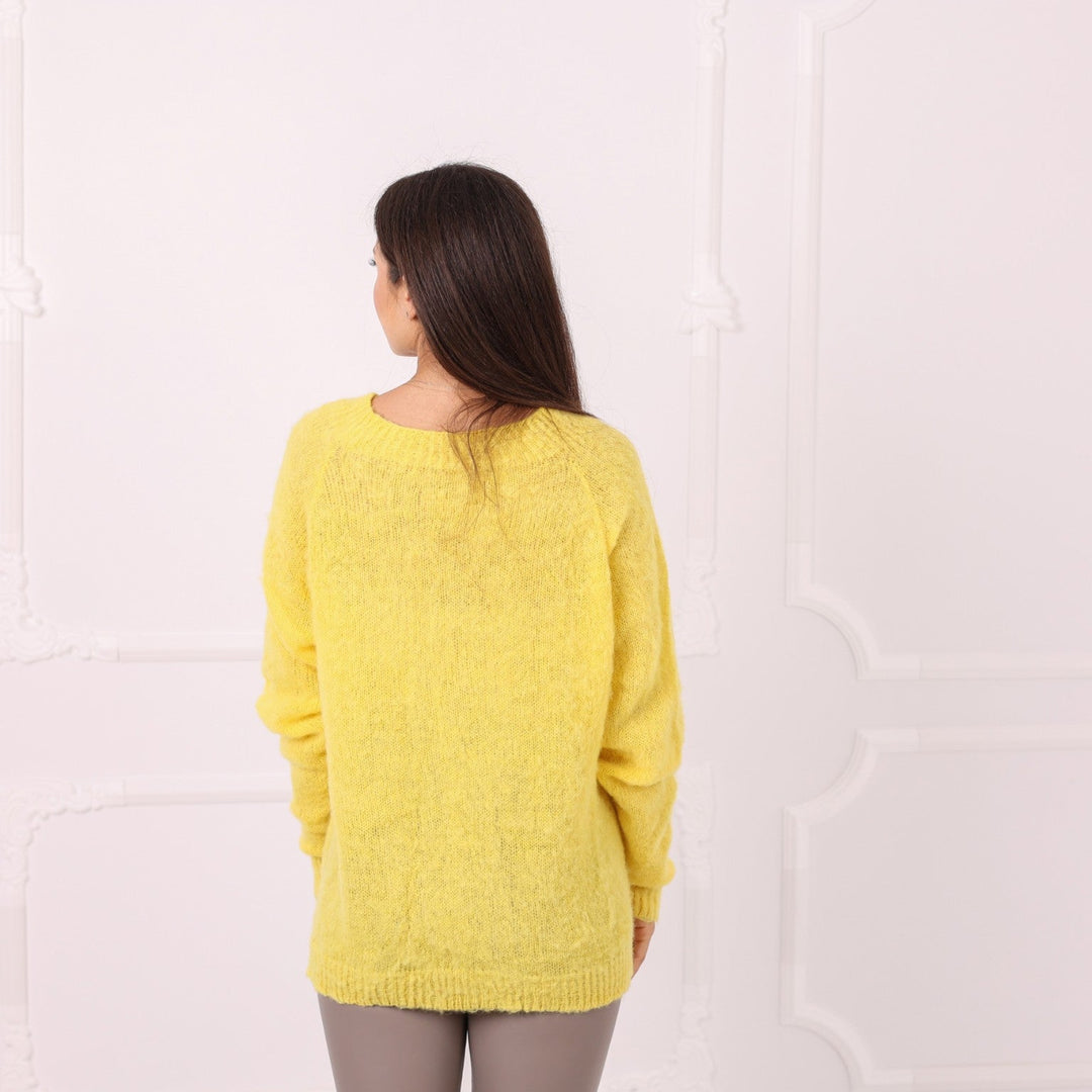 Back view of fluffy yellow baby alpaca sweater without turtleneck