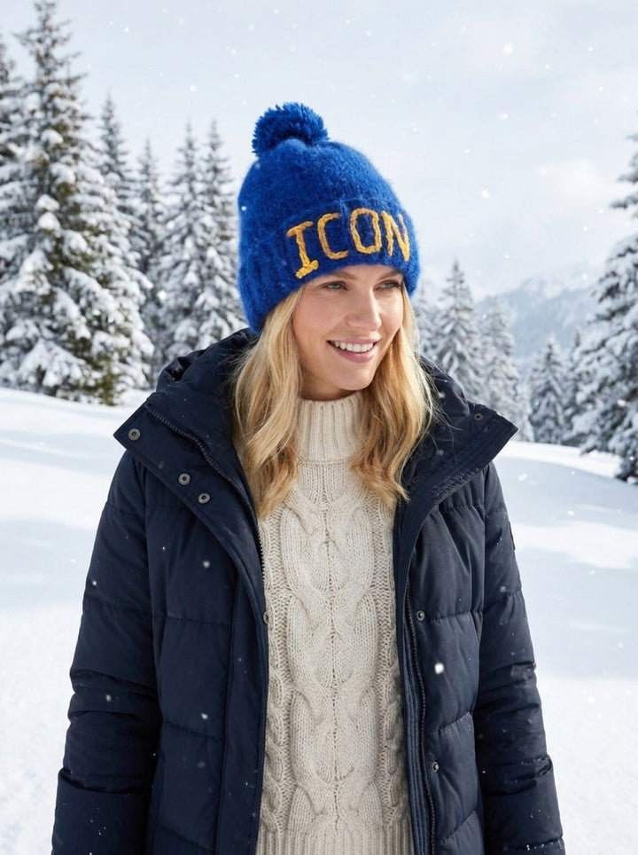 Blue brushed alpaca personalized beanie with pom pom in winter snow