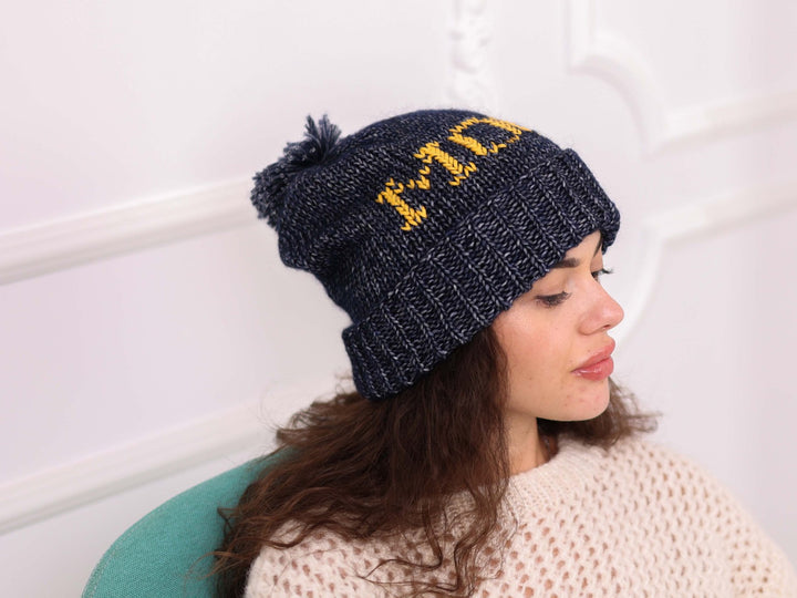 Side view of personalized cotton wool beanie with yellow name embroidery
