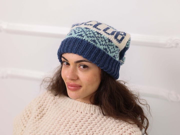 Angled view of blue cream soft wool personalized SKI CLUB knit beanie