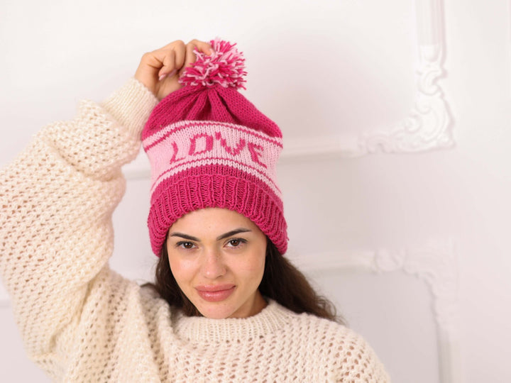 Model wearing pink soft wool personalized LOVE beanie