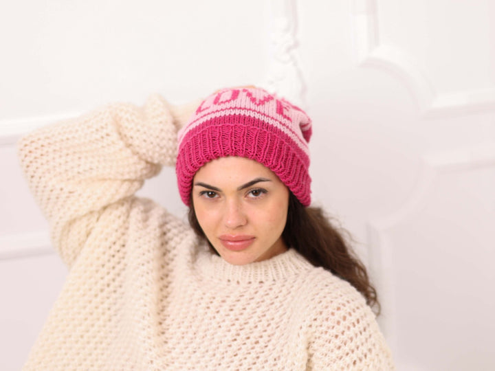 Portrait model wearing pink and light pink soft wool LOVE beanie