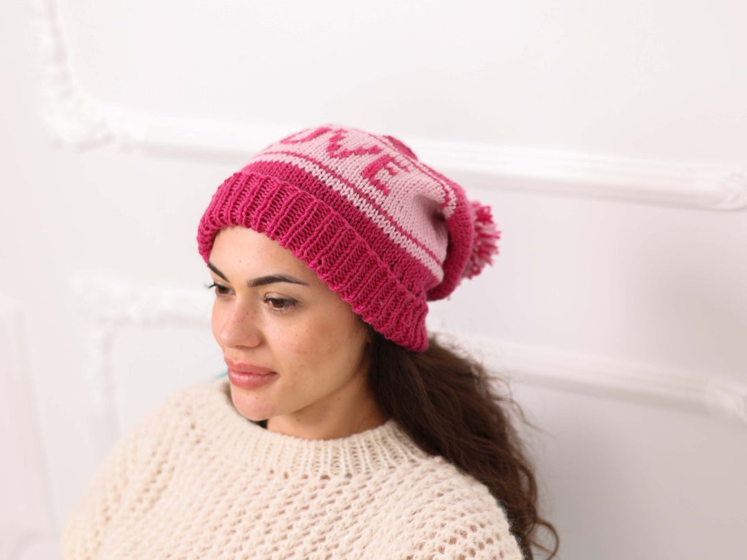 Side view of pink soft wool personalized LOVE knit beanie