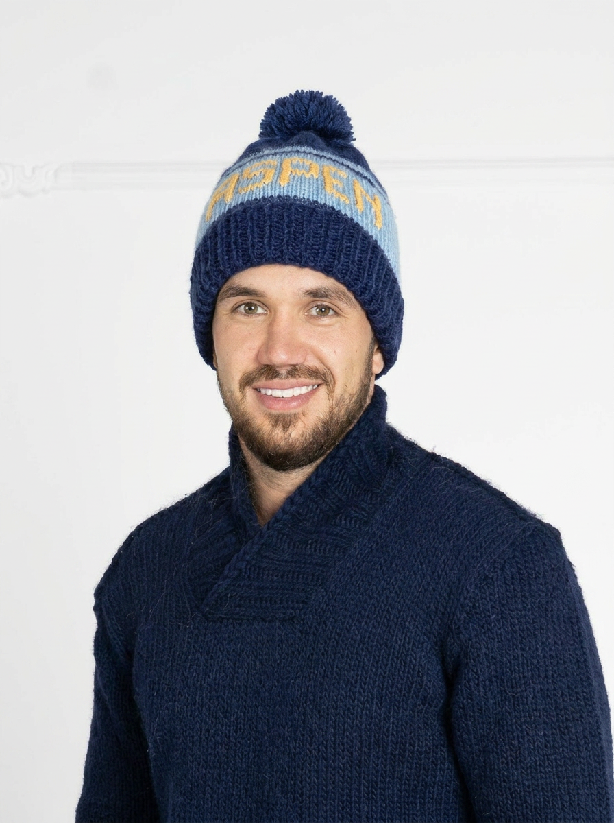 Man wearing a blue knit sweater and beanie with text on a white background