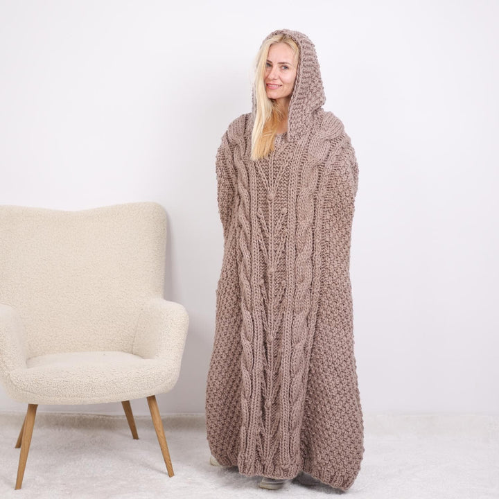 One available  Wool Poncho with cables and a hood T1896