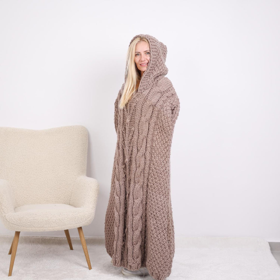 One available  Wool Poncho with cables and a hood T1896