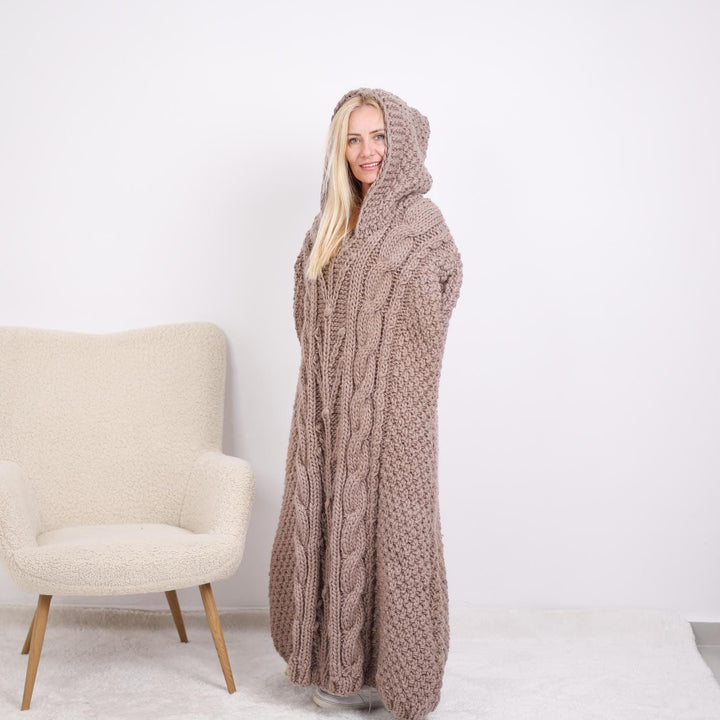 One available  Wool Poncho with cables and a hood T1896