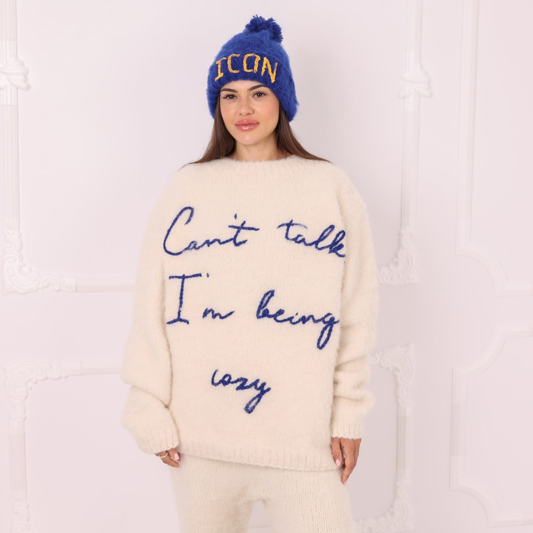Hand knitted personalized cream alpaca sweater with custom blue lettering