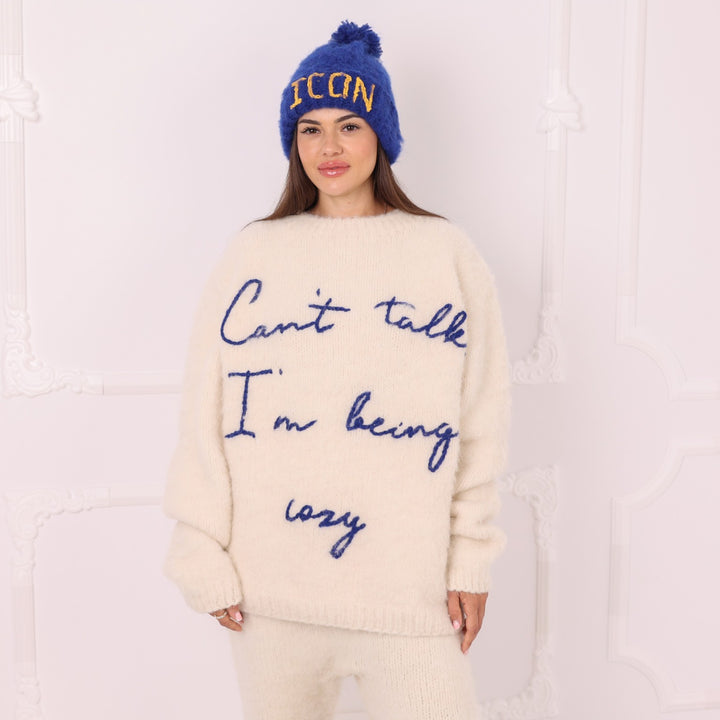Hand knitted personalized cream alpaca sweater with custom blue lettering