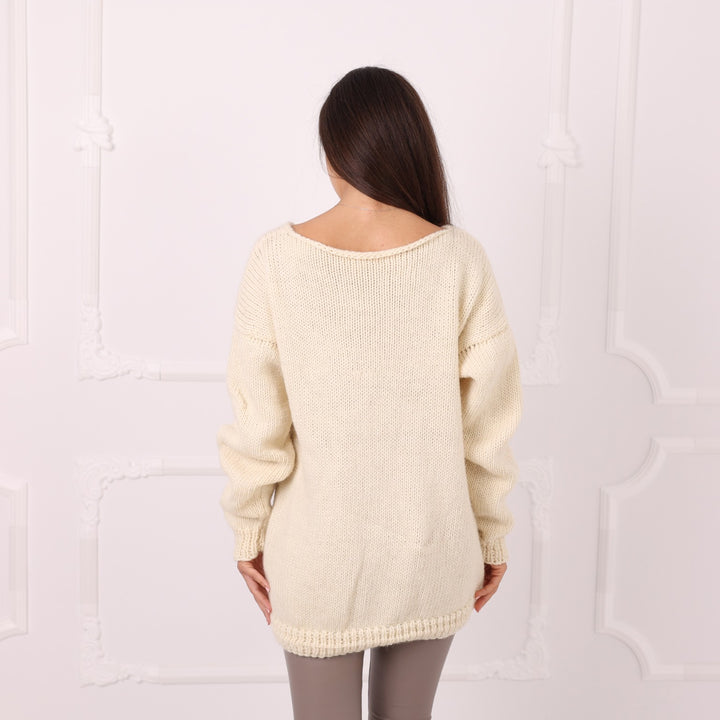 Back view of handmade cream wool sweater without turtleneck