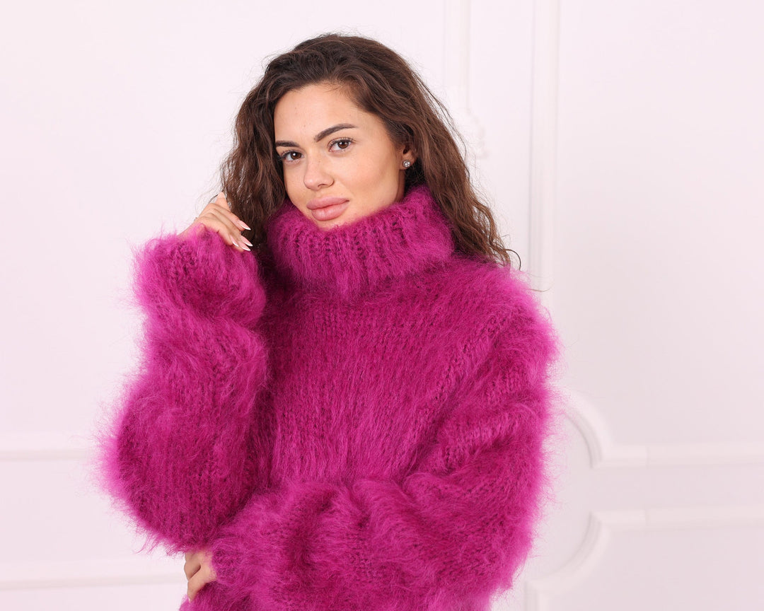 Pink fluffy mohair turtleneck sweater collar and sleeve detail