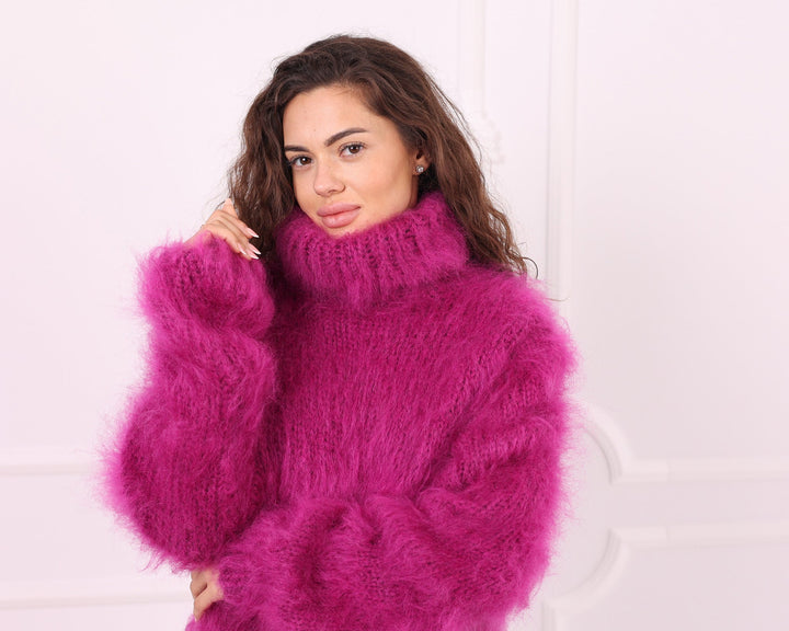 Pink fluffy mohair turtleneck sweater collar and sleeve detail