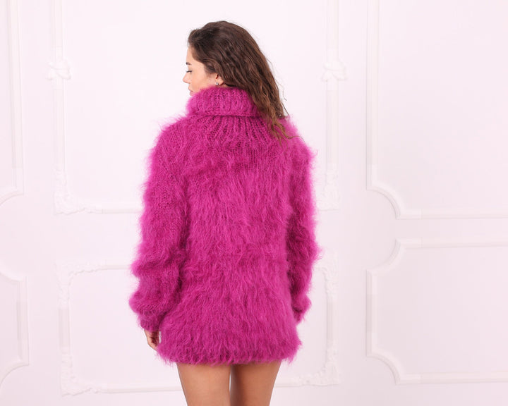 Pink mohair oversized turtleneck sweater back three quarter view