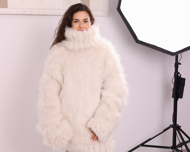 Cream long-haired alpaca oversized turtleneck sweater front studio view