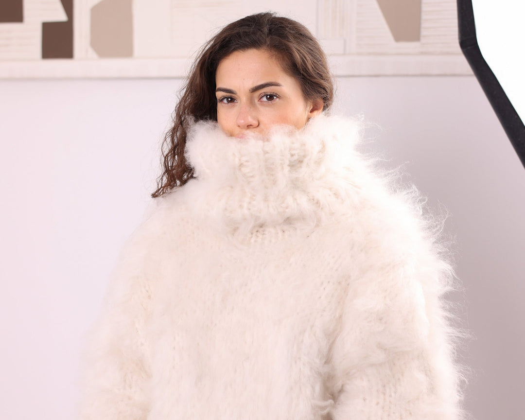Cream long-haired alpaca oversized turtleneck sweater close-up