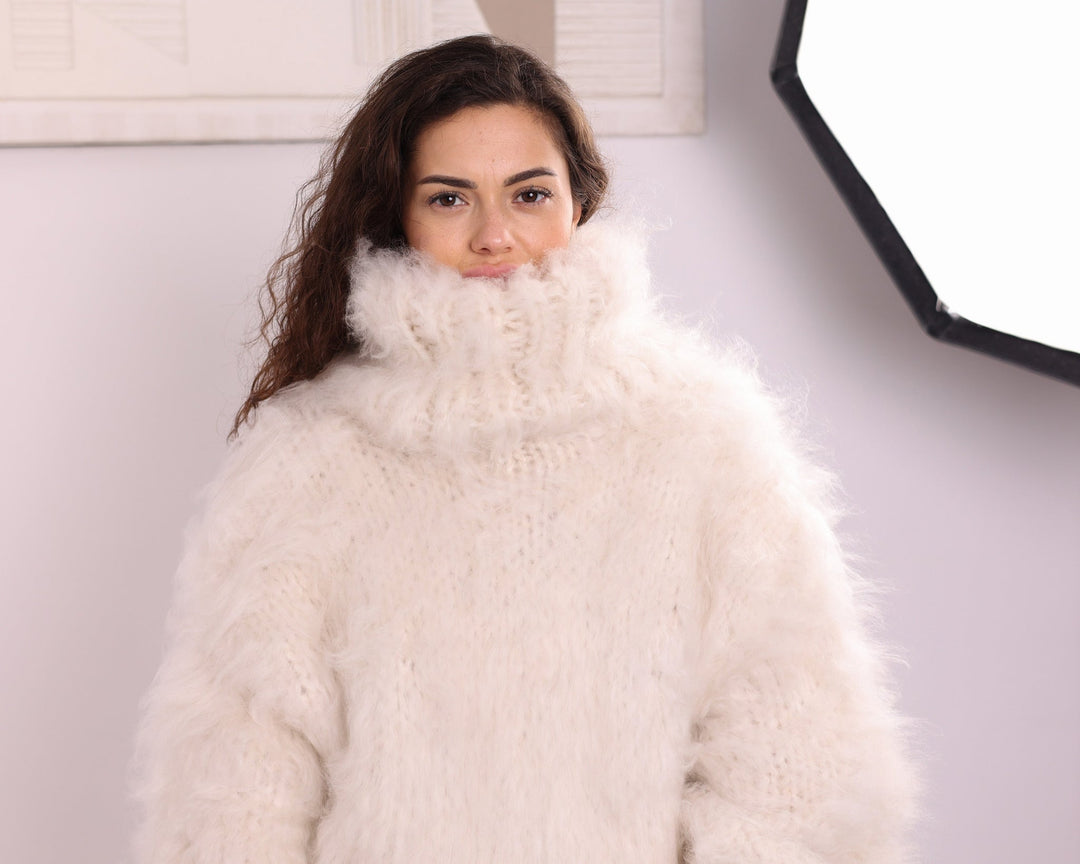 Cream fluffy long-haired alpaca turtleneck sweater front portrait close-up
