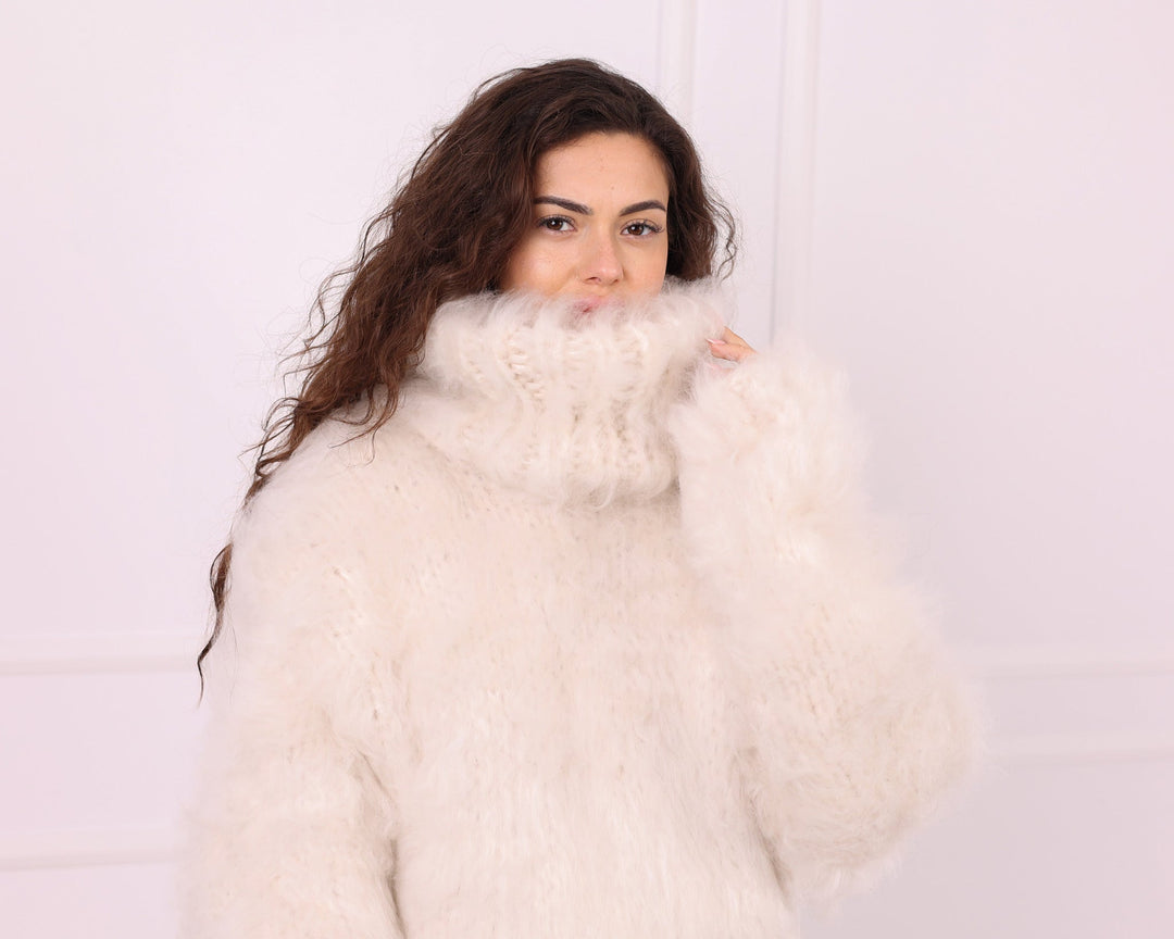 Cream long-haired alpaca oversized turtleneck sweater close-up studio view