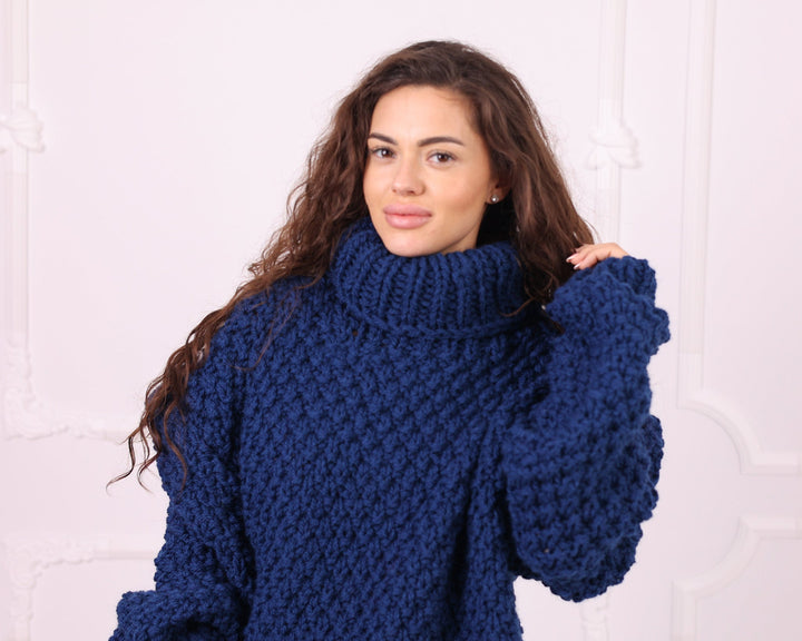 Blue chunky wool turtleneck sweater close-up front