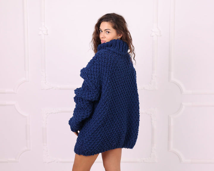 Blue chunky wool turtleneck sweater three-quarter back view