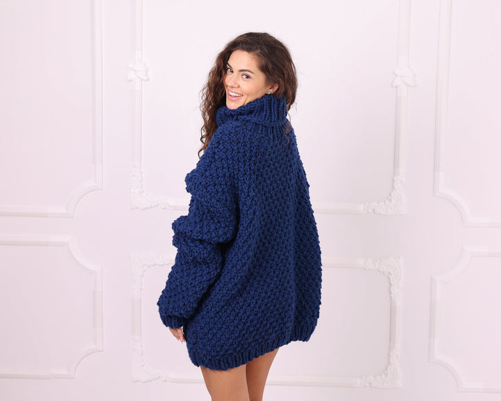 Blue oversized wool turtleneck sweater side view