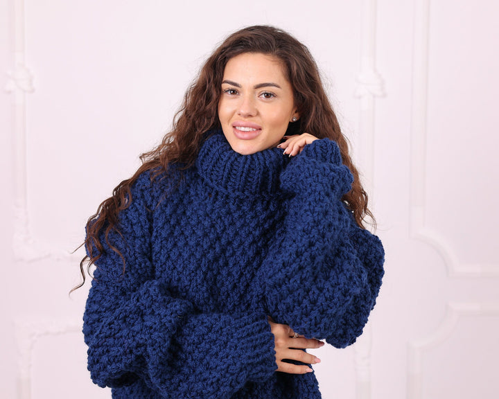 Blue chunky wool turtleneck sweater close-up detail
