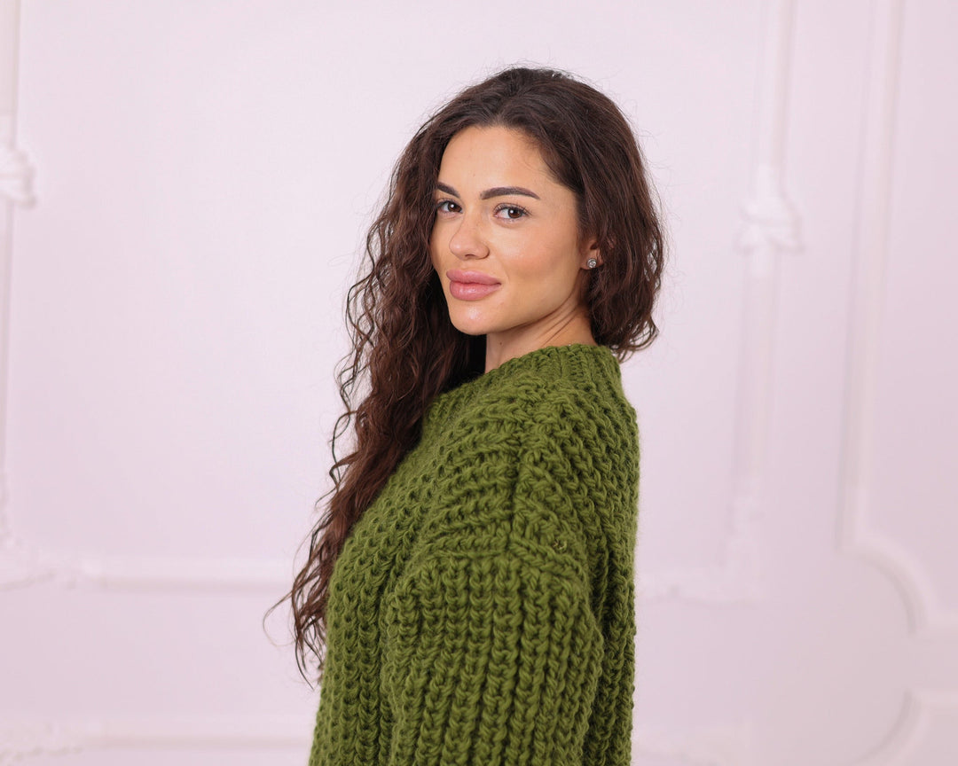 Green chunky wool oversized sweater close-up