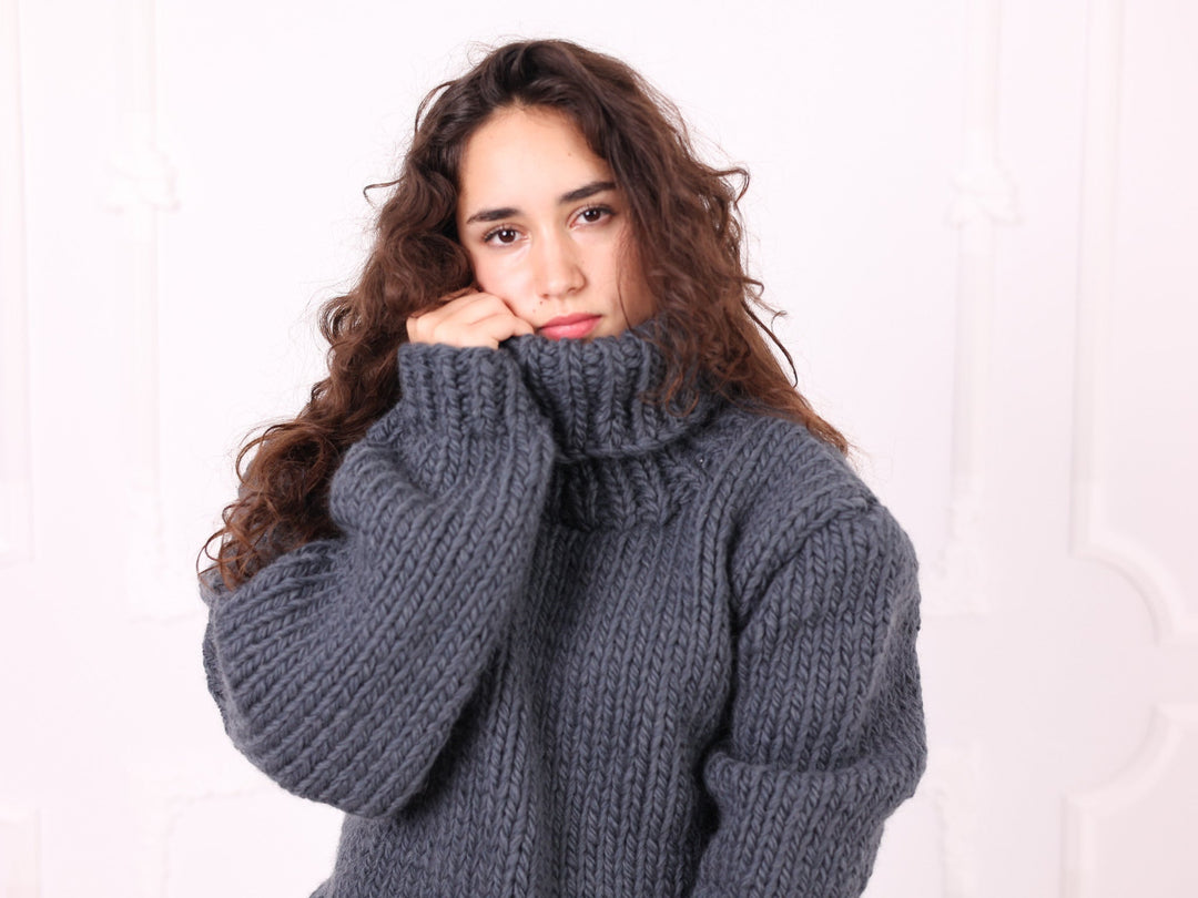 Gray 100% wool turtleneck sweater close-up front view