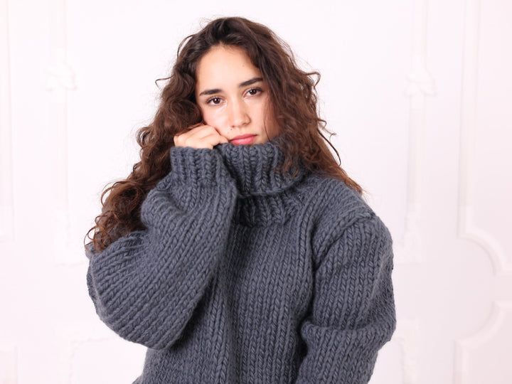 Gray 100% wool turtleneck sweater close-up front view