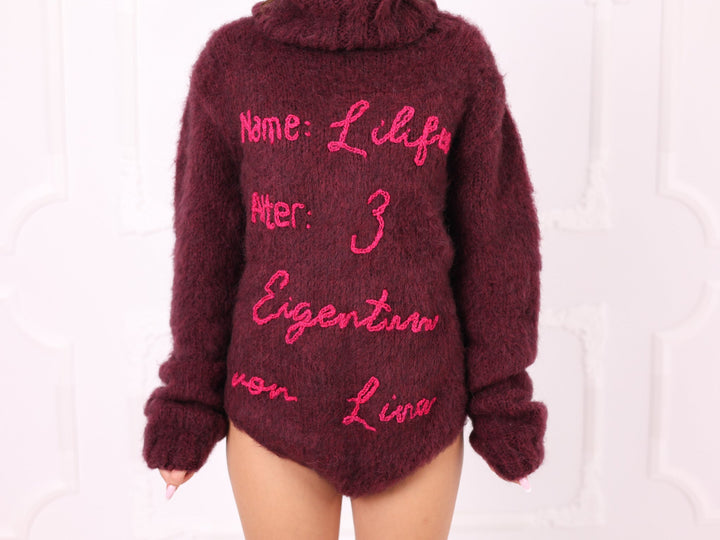 Burgundy personalized alpaca bodysuit embroidery close-up