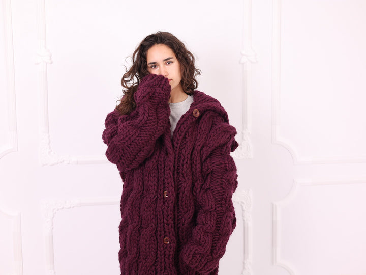 Burgundy chunky wool cable knit cardigan close-up