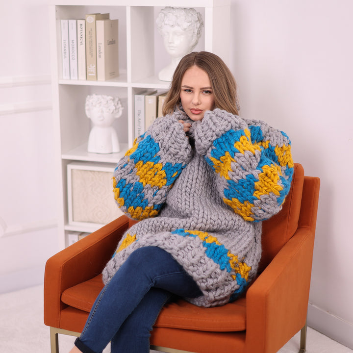 Grey extra chunky Nordic wool turtleneck sweater seated T2402